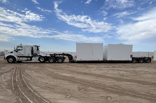 Removable gooseneck trailer configured for loading heavy machinery for specialized transportation.
