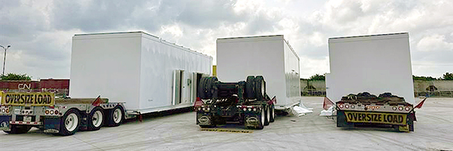 Buchanan Hauling transporting a generator on heavy haul equipment for a commercial power project.