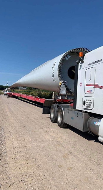 Buchanan Hauling heavy haul equipment transporting a wind turbine blade for a commercial wind energy project.