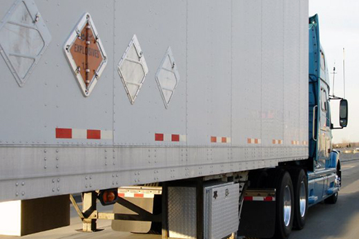 Buchanan Hauling equipment transporting regulated hazardous materials freight for an industrial customer.