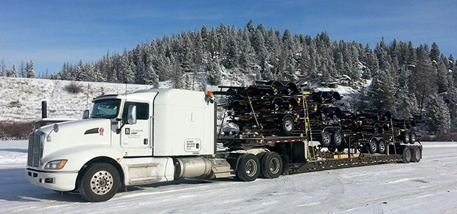 Industrial freight loaded on Buchanan Hauling flatbed equipment for cross border transportation.