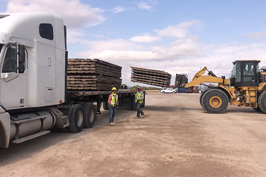 Industrial freight loaded on Buchanan Hauling flatbed equipment for commercial transportation.