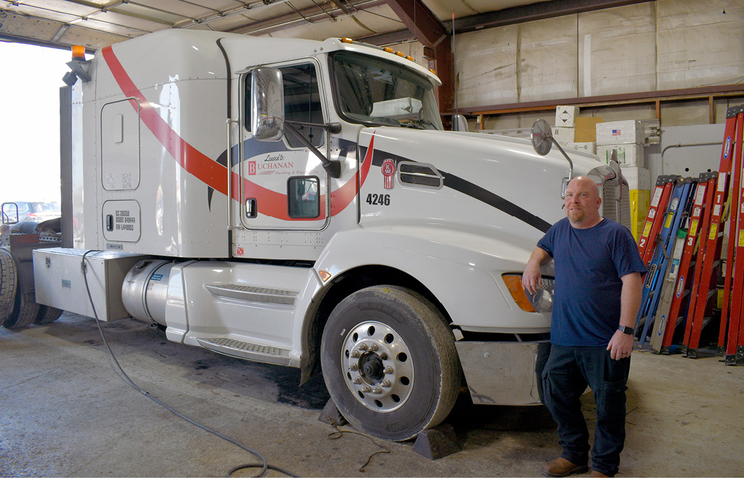 Michael P. standing next to his truck