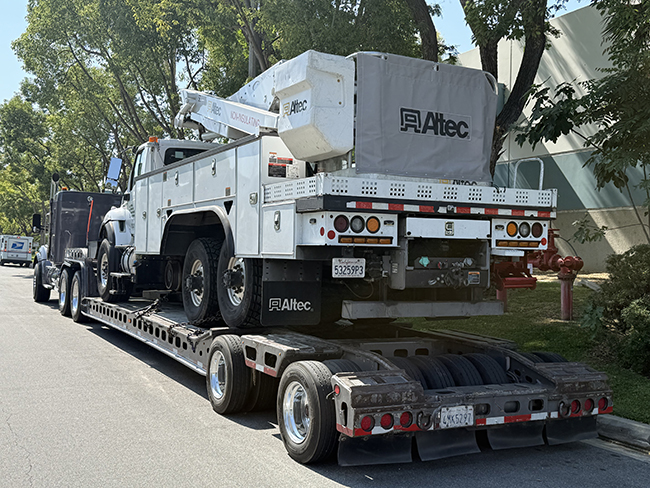 Heavy haul trucking transporting oversized industrial equipment along highway route.