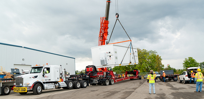 Specialized freight transport hauling large industrial equipment.