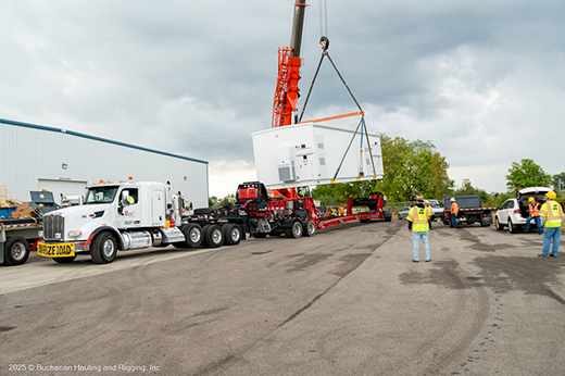 Specialized freight transport hauling large industrial equipment.