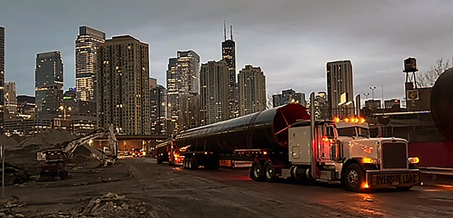 flatbed freight carrier transporting construction materials