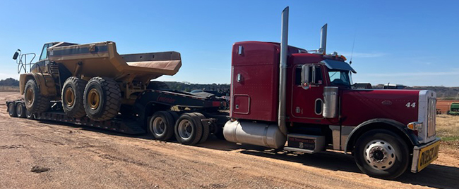 Specialized trailer transporting manufacturing equipment.