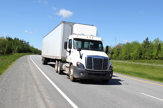 Emergency freight trucking transporting urgent cargo across highway.
