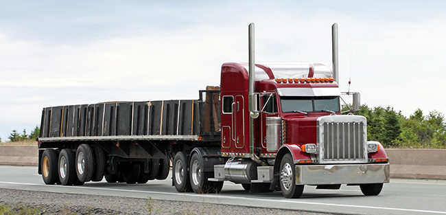 Expedited freight truck transporting urgent manufacturing components.
