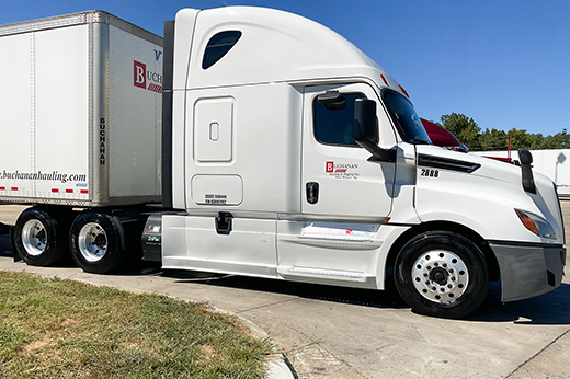 Nationwide freight trucking transporting goods across interstate highway.