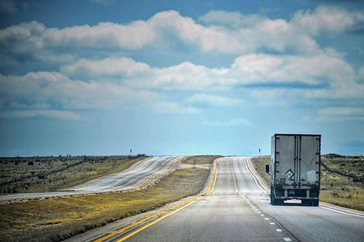 semi truck transporting freight across interstate highway