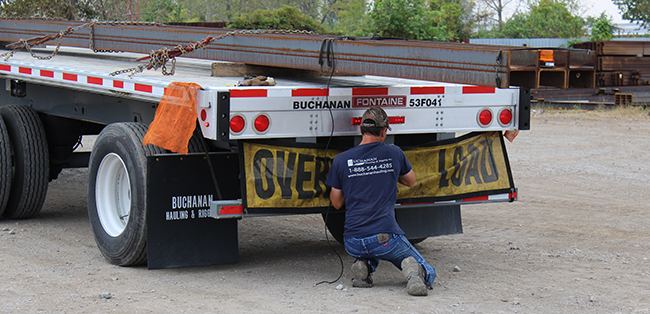 steel beams loaded on flatbed trailer for freight transport