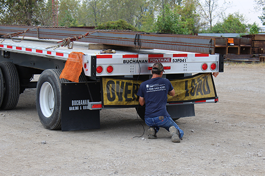 steel beams loaded on flatbed trailer for freight transport