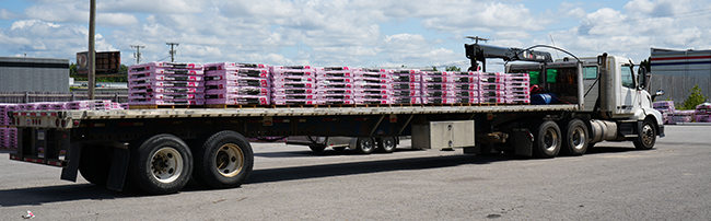 flatbed truckload transporting industrial freight across the United States