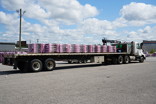 flatbed truckload transporting industrial freight across the United States