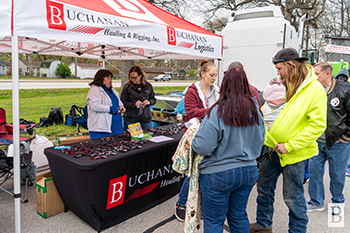 Buchanan employees hand out swag to kids and parents at the local Touch-A-Truck event, where kids were able to sit in a Buchanan semi. Buchanan employees hand out swag to kids and parents at the local Touch-A-Truck event, where kids were able to sit in a Buchanan semi.