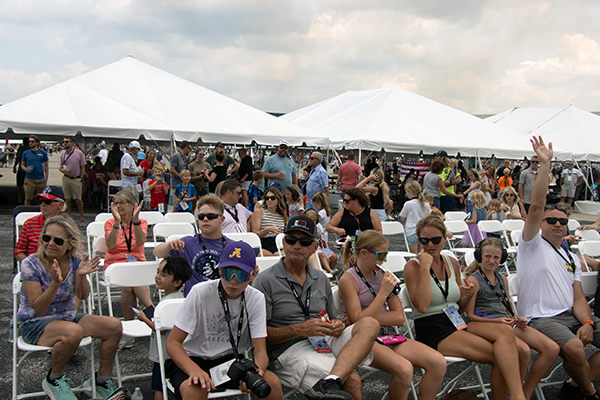 Buchanan Hauling and Rigging employees sitting close to the Air Show action!
