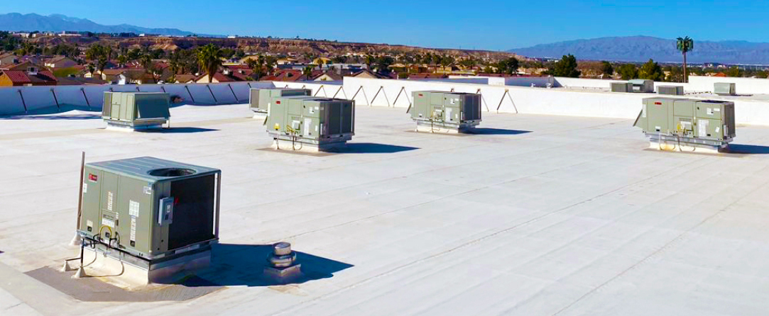 HVAC units on top of a commercial retail outlet in the hottest part of the United States.