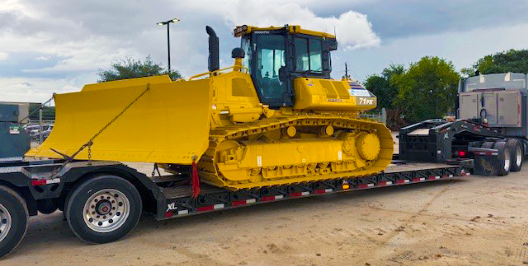 Buchanan Hauling and Rigging Heavy Haul Division transporting a bulldozer to a jobsite to be used for construction.