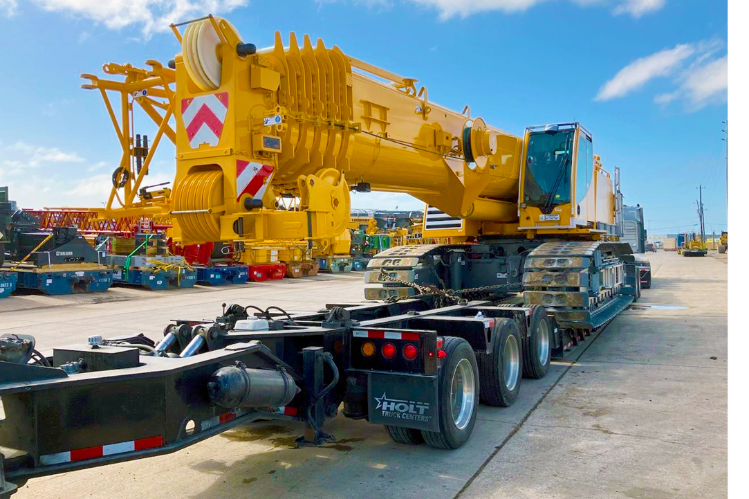 Buchanan Hauling and Rigging Heavy Haul Division transporting a crane to a jobsite to be used for construction.
