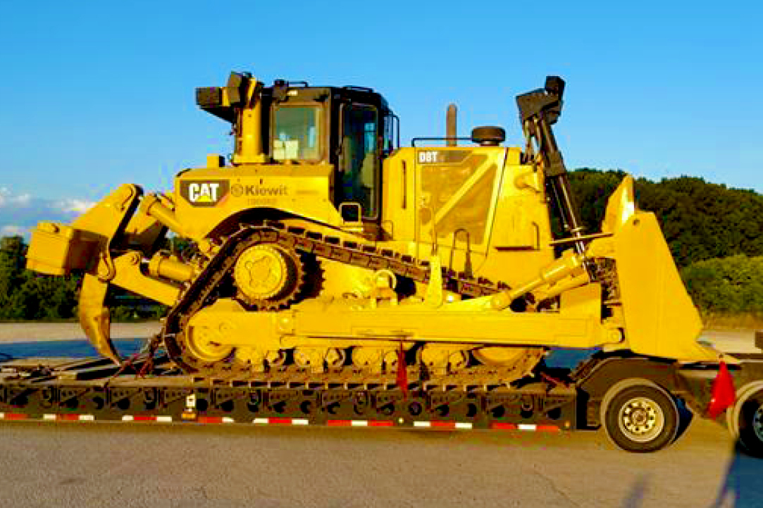 Buchanan Hauling and Rigging Heavy Haul Division transporting a bulldozer to a jobsite to be used for construction.