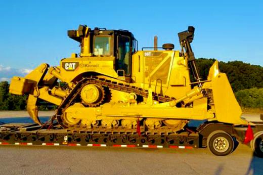 Buchanan Hauling and Rigging Heavy Haul Division transporting a bulldozer to a jobsite to be used for construction. Buchanan Hauling and Rigging Heavy Haul Division transporting a bulldozer to a jobsite to be used for construction.