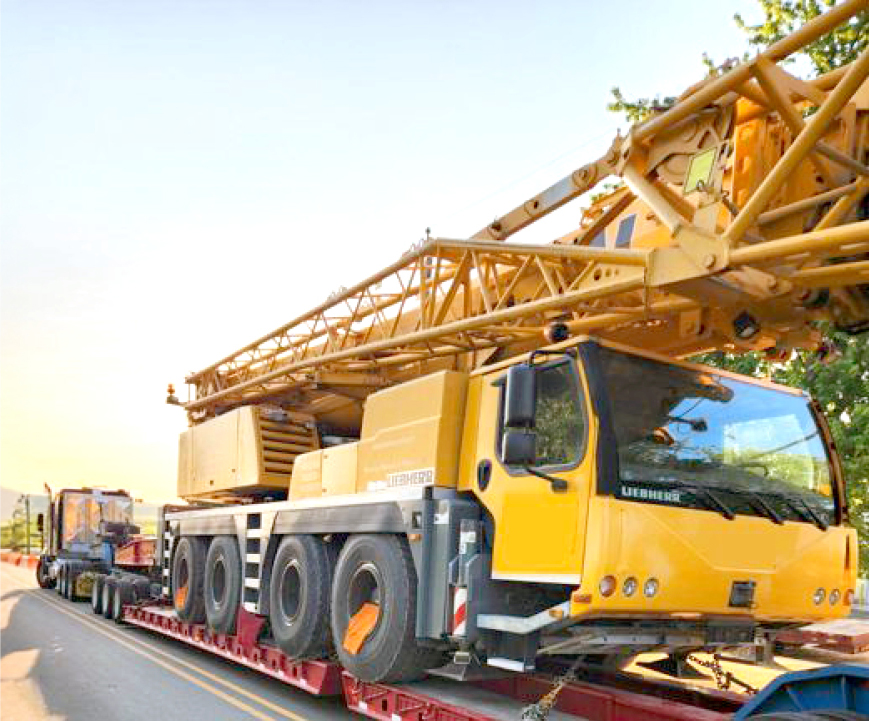 Buchanan Hauling and Rigging transporting amobile crane to a jobsite.