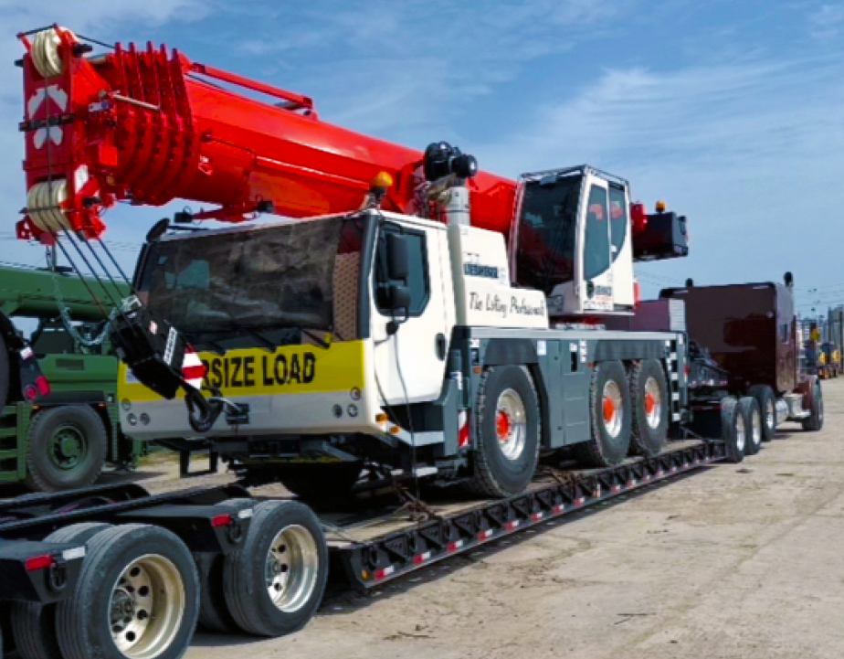 Buchanan Hauling and Rigging transporting a crane to a jobsite.