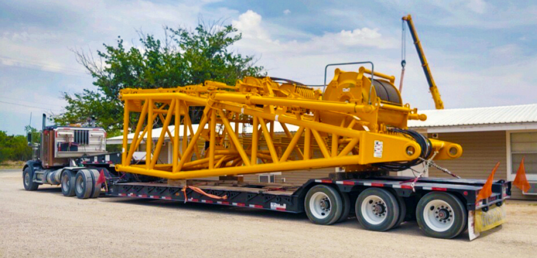 Buchanan Hauling and Rigging transporting a section of crane to a jobsite.
