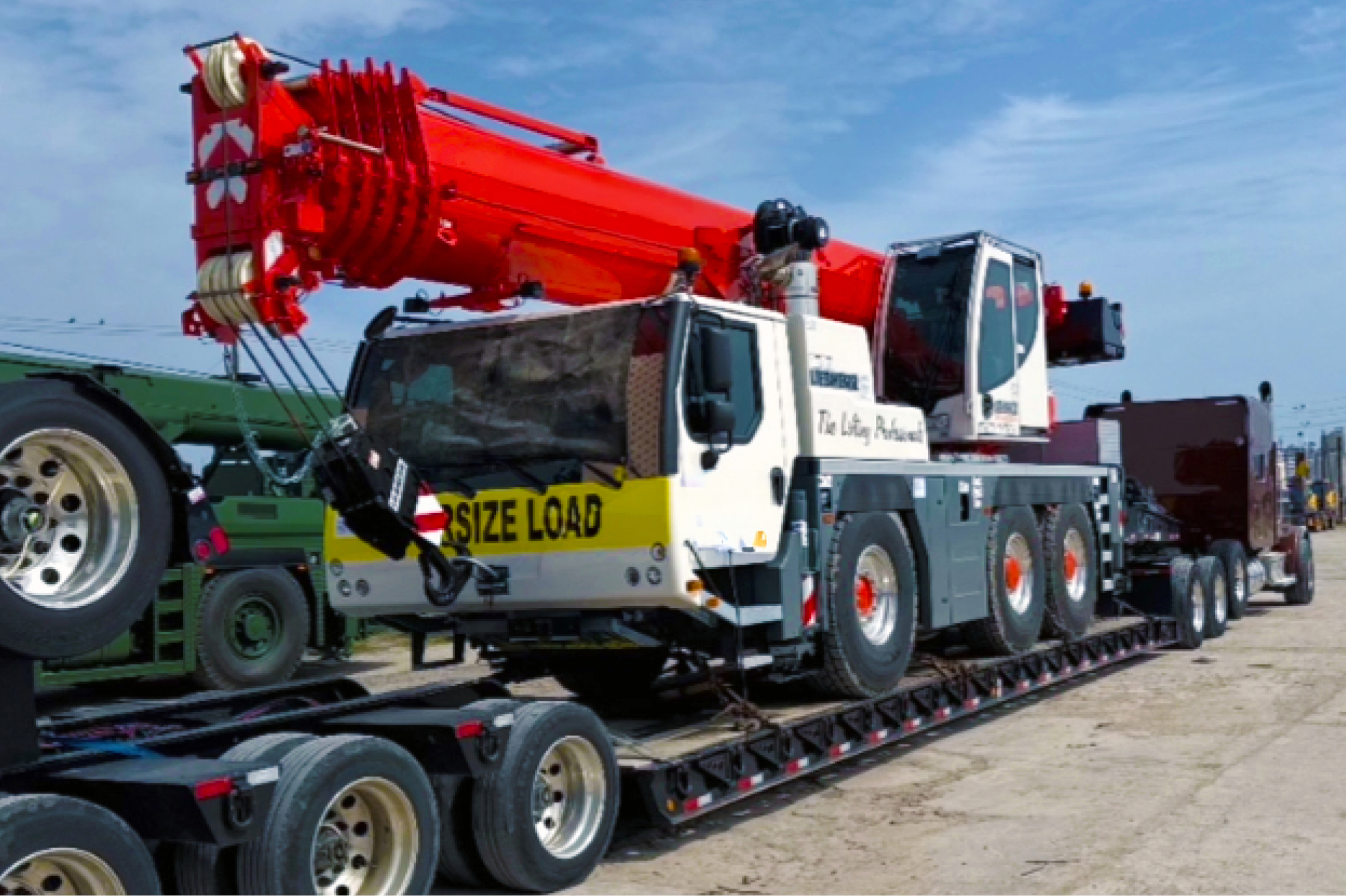 Buchanan Hauling and Rigging transporting a crane to a jobsite.