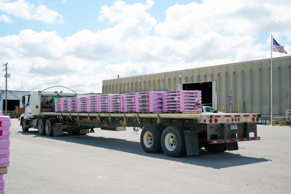 Buchanan Hauling loading up shingles and building materials to be shipped to a retail customer.