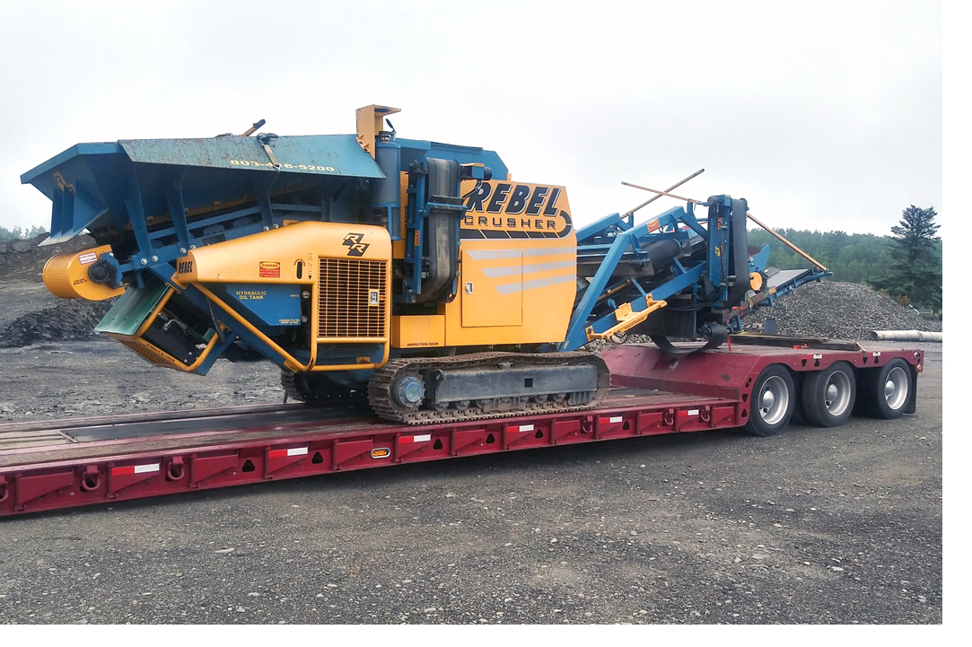 Buchanan Hauling transporting a piece of mining equipment to the jobsite.