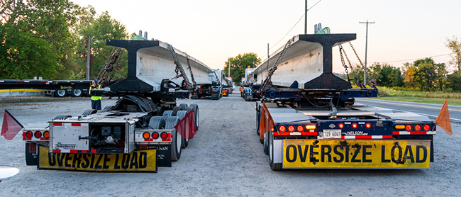 Buchanan Hauling Heavy Haul Division transports girders for a highway project in Detroit.