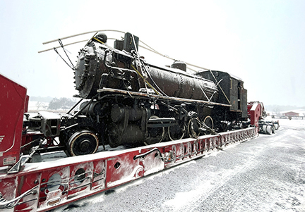 Buchanan Hauling Heavy Haul Division transport a steam engine to a museum for restoration.