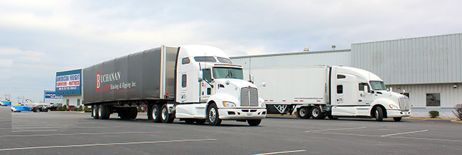 Buchanan Hauling and Rigging fleet providing flatbed, dry van, heavy haul, and specialized freight transportation services.