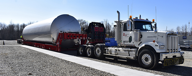 Buchanan Hauling Heavy Haul Division transports a silo tank that will hold liquids.