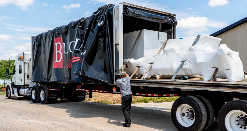 Expedited Services Buchanan Hauling and Rigging Expedited truck on a conestoga