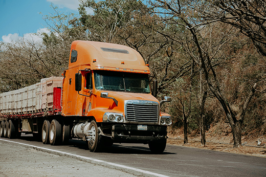 Truck transporting heavy freight across state highways