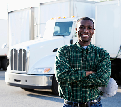 Experienced veteran operating a Buchanan Hauling & Rigging semi truck transporting commercial freight.