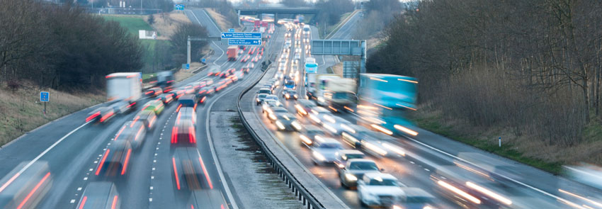 Highway full of cars and semis driving through traffic, timelapse