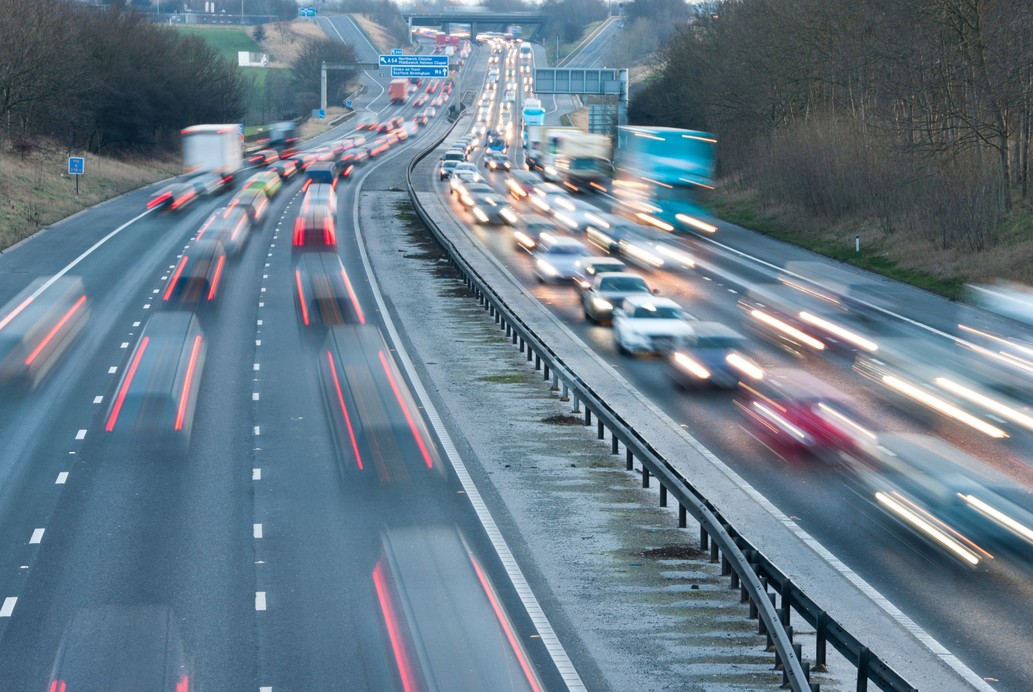 Highway full of cars and semis driving through traffic, timelapse